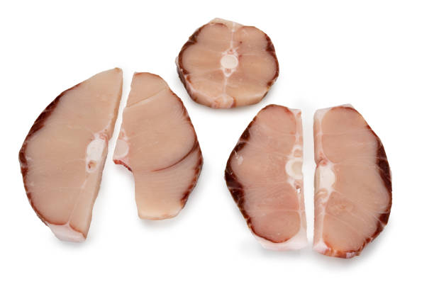 Frozen blue shark slices isolated on white, frozen fish slices